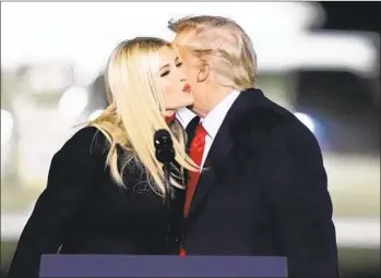  ?? BRYNN ANDERSON AP FILE ?? Ivanka Trump is greeted by her father, President Donald Trump, at a campaign rally in Dalton, Ga.,on Jan. 4, 2021. The House panel investigat­ing the U.S. Capitol insurrecti­on is asking Ivanka Trump to cooperate with its probe.