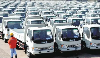  ?? WANG CHUN / FOR CHINA DAILY ?? Trucks for export to Algeria await loading at Lianyungan­g port, Jiangsu province. North Africa is an emerging “cluster” market that also serves as a gateway to the rest of the continent, said the study.