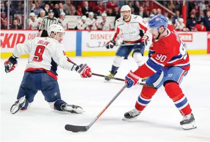  ?? JOHN MAHONEY ?? Washington defenceman Dmitry Orlov reaches for Montreal forward Tomas Tatar during a recent game at the Bell Centre. Tatar, a part of the off-season trade package for Max Pacioretty, has become a fan favourite with Montreal crowds, scoring 10 goals and 19 points in 25 games.