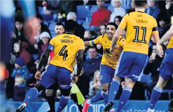  ??  ?? Jayden Mitchell-Lawson, centre, shows his delight at scoring for Bristol Rovers against Wycombe