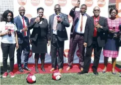  ?? Picture by MICHAEL MIYOBA ?? Ministry of general education PS Henry Tukombe (center)and Coca-Cola Regional Franchise Director Phillipine Mtikitiki (third from left)with ZASSA members during the launch of Copa Coca-Cola school soccer tournament in Lusaka.