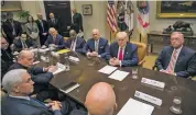  ?? STEPHEN CROWLEY THE NEW YORK TIMES ?? President Donald Trump meets Monday with chief executives from health insurance companies in the Roosevelt Room of the White House in Washington.
