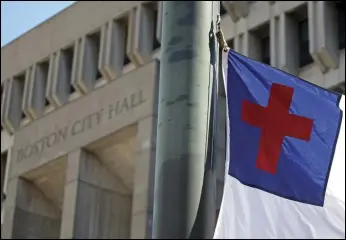  ?? ?? The city of Boston has agreed to pay more than $2.1 million to the Christian legal organizati­on that backed a court challenge after the city refused to fly a Christian flag outside City Hall, a case that made it all the way to the US Supreme Court.