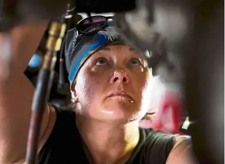  ?? — Photos: AFP ?? Sweeney, shop forewoman at the Girls Auto Clinic, works at a garage where a fleet of women mechanics is breaking the mold in the male-dominated industry.