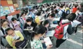  ?? PROVIDED TO CHINA DAILY ?? From left: Examinees make time for last-minute revision before the first gaokao exam of the year in Haian, Jiangsu province. Parents welcome children who have XU JINGBAI / XINHUA. completed the exam at the Affiliated School of Peking University in Beijing. WANG JING / CHINA DAILY. Wang Chaorong enrolled at New York University to study art history after paying high tuition fees for a private high school in the US.