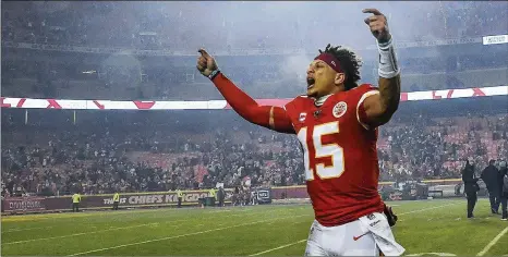  ?? PHOTOS BY RICH SUGG / KANSAS CITY STAR ?? Chiefs QB Patrick Mahomes celebrates his team’s 51-31 victory over the Texans last Sunday in Kansas City, Missouri. He said he’s been moving around better recently: Against the Texans, he consistent­ly extended plays and finished as the Chiefs’ leading rusher, with 53 yards.