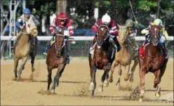  ?? PHOTO ARIANNA SPDONI/ NYRA ?? Tenfold, center, races to the front of the field to capture the 2018G1Jim Dandy Stakes at Saratoga Race Course.