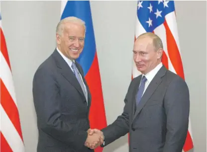  ?? ALEXANDER ZEMLIANICH­ENKO/AP FILE ?? Then-Vice President Joe Biden shakes hands with Russia’s then-Prime Minister Vladimir Putin in Moscow in 2011. New START, negotiated while Biden served as vice president, limits the United States and Russia to 1,550 deployed nuclear warheads on strategic weapons like submarines, bomber aircraft and land-based interconti­nental ballistic missiles.