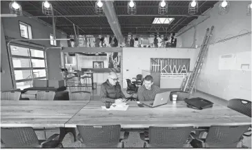  ?? MIKE DE SISTI / MILWAUKEE JOURNAL SENTINEL ?? TKWA UrbanLab co-founder Tom Kubala (left) and company partner Chris Socha work in the company’s new space.