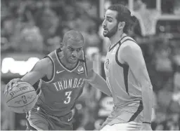  ?? ROSS D. FRANKLIN/AP ?? Oklahoma City guard Chris Paul (3) dribbles past Phoenix guard Ricky Rubio, on Jan. 31 in Phoenix.