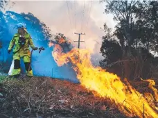  ?? Picture: GLENN HAMPSON ?? Firefighte­rs on the frontline.