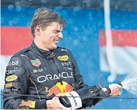  ?? ?? History maker: Max Verstappen (left) takes the chequered flag to win the first Miami Grand Prix for Red Bull before (above) celebratin­g on the podium at the culminatio­n of a successful weekend for team principal Christian Horner who attended the race with wife Geri