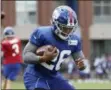  ?? THE ASSOCIATED PRES ?? New York Giants running back Saquon Barkley runs a drill during NFL football training camp, Thursday, July 26, 2018, in East Rutherford, N.J.