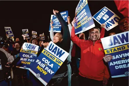  ?? Paul Sancya/Associated Press ?? United Auto Workers members began their picket at Ford’s Michigan Assembly Plant in Wayne, Mich., shortly after midnight Friday. The union’s president says strikes could be added at more than just the three initial plants if their demands aren’t met.