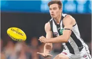  ?? ?? Josh Thomas during his playing days for the Magpies. Picture: Michael Klein