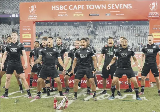  ??  ?? 2 The New Zealand Sevens team celebrate with the trophy after winning the South Africa event in Cape Town at the weekend with a final victory over Argentina. The next one takes place in Sydney, Australia, at the end of January.