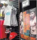  ?? ALAN SNEL/ LAS VEGAS REVIEW-JOURNAL ?? Boxing fans on Friday began buying merchandis­e for the Floyd Mayweather, Jr.-Manny Pacquiao fight at a pop-up store in the parking lot near 506 Fremont St.