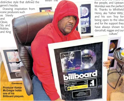  ?? ?? CONTRIBUTE­D Producer Kemar McGregor holds one of his Billboard plaques.