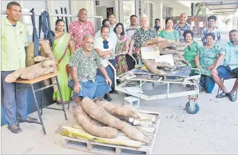  ?? Picture: REINAL CHAND ?? Fiji National University’s Farmers and Wellness Club members with their yams at the Natabua campus in Lautoka.
