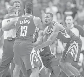  ?? Yi-Chin Lee / Houston Chronicle ?? Rockets guard James Harden (13) is separated from the Grizzlies’ Mario Chalmers, left, after a confrontat­ion in the fourth quarter.