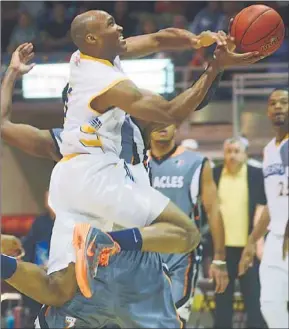  ?? GUARDIAN PHOTO BY NIGEL ARMSTRONG ?? Summerside Storm’s Antonio Ballard goes airborne on his way to the basket during Thursday night’s National Basketball League of Canada game against the Moncton Miracles at the Eastlink Centre.