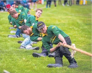  ?? Picture: Steven Brown. ?? The Strathardl­e team taking part in the tug o’ war against Elgin.