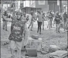  ?? PTI FILE ?? Police personnel and protesters clash during a rally against the amended Citizenshi­p Act and NRC in Mangaluru on Dec 19.