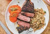  ?? CHEYENNE COHEN/AP ?? A grilled marinated New York strip steak