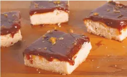  ?? GLENN KOENIG/LOS ANGELES TIMES ?? A rich shortbread is topped with a thick coating of caramel.