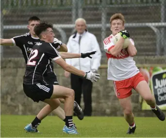  ??  ?? Richie Mullan of Derry in action against Ciaran O’Dowd of Sligo during the All-Ireland Quarter Final.