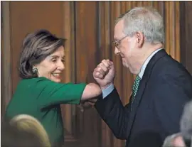  ?? Susan Walsh Associated Press ?? HOUSE SPEAKER Nancy Pelosi and Senate Majority Leader Mitch McConnell avoid a handshake Thursday at a lunch with Irish Prime Minister Leo Varadkar.