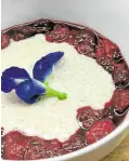  ??  ?? Warm Vanilla Cinnamon Spiced Tres Leches Lugaw with Raspberry and Goji Berry Compote by chef Roselle Sison-Pangalilin­gan