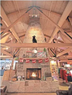  ?? CHELSEY LEWIS / MILWAUKEE JOURNAL SENTINEL ?? A large stone fireplace is a focal point at the Leinie Lodge at Leinenkuge­l's Brewery in Chippewa Falls. Leinenkuge­l’s is marking its 150th anniversar­y this year.