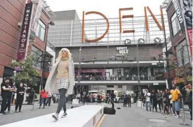  ?? Andy Cross, The Denver Post ?? A model participat­es in the Uniqlo fall fashion show at the Denver Pavilions on the 16th Street Mall on Friday. “We look forward to bringing Uniqlo to the vibrant city of Denver,” a company executive says.