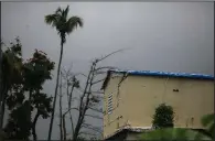  ?? AP/DENNIS M. RIVERA PICHARDO ?? A tarp serves as the roof of a home in Yabucoa, Puerto Rico, that was damaged last year by Hurricane Maria. The remnants of Tropical Storm Beryl passed over the region Monday.