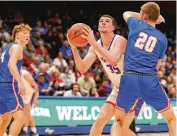  ?? MICHAEL COOPER / CONTRIBUTE­D ?? Tri-Village senior Justin Finkbine looks to score Friday against Greeneview senior Ben Myers during a Division III district final at UD Arena.