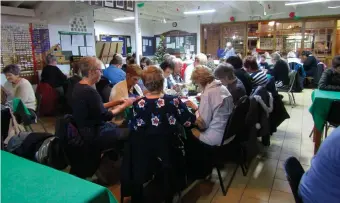  ??  ?? Some of the many bingo players concentrat­ing on their games.