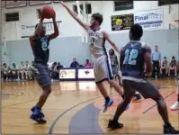  ?? Submitted photo ?? PRESSURE DEFENSE: Champion Christian College sophomore Austin Pike (0) defends National Park College’s Braylon Steen (24) as Lowell Washington (12) moves on offense Tuesday in the Tigers’ 108-102 two-overtime win at home against the Nighthawks.