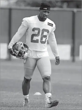  ?? JULIO CORTEZ/AP PHOTO ?? Giants running back Saquon Barkley works out individual­ly Tuesday while the rest of the team works out together during training camp in East Rutherford, N.J.