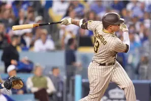  ?? (AP Photo/Ashley Landis, File) ?? San Diego Padres’ Manny Machado follows through on an RBI-double Oct. 12, 2022, during the third inning in Game 2 of a baseball NL Division Series against the Los Angeles Dodgers, in Los Angeles. Machado and San Diego conclude their season series against Mookie Betts and Los Angeles with the finale of a three-game set Wednesday, Sept. 13, 2023. The Dodgers won the NL West title in 2022 for the ninth time in 10 years, but they were eliminated by the second-place Padres in their NL Division Series.