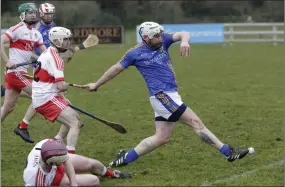  ??  ?? Wicklow’s Andy O’Brien drives home this goal during the NHL Division 2B clash with Derry in Bray last Sunday afternoon.