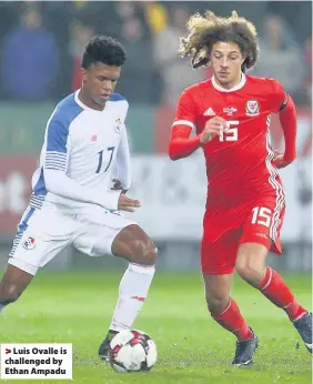  ??  ?? > Luis Ovalle is challenged by Ethan Ampadu