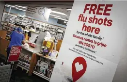  ?? Marco Bello / Bloomberg ?? CVS Health is gearing up for a busy winter with a pandemic and possible flu surge. The company is looking to hire thousands, including remote workers, to handle the business.