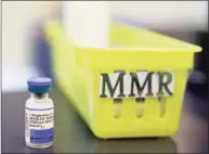  ?? Eric Risberg / Associated Press file photo ?? A measles, mumps and rubella, or MMR vaccine, sits on a countertop at a pediatrics clinic in Greenbrae, Calif.