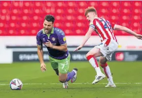 ??  ?? Bristol City’s Chris Martin takes a tumble after being fouled by Sam Clucas