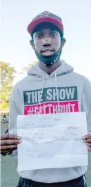  ??  ?? LEFT: Corey Brown holds up a letter one of his young athletes wrote him this week, thanking him for ‘‘giving me baseball’’ and working ‘‘so hard to take care of us.’’