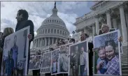  ?? GABRIELLA DEMCZUK — THE NEW YORK TIMES ?? Senators walk down the steps of the U.S. Capitol calling for the end of the shutdown in Washington on Wednesday.