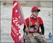  ?? ROGELIO V. SOLIS — AP ?? An unidentifi­ed participan­t of a pro-Trump protest sits on the steps of the Mississipp­i Capitol after the small rally concluded, Wednesday, Jan. 6, 2021 in Jackson, Miss.