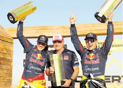  ?? ALASTAIR STALEY/LAT IMAGES ?? Laia Sanz of Spain (left) and Jamaica’s Fraser McConnell (right) Acciona | Sainz XE Team’s Carlos Sainz celebrate after their victory in Extreme E Round 2 in Saudi Arabia yesterday.