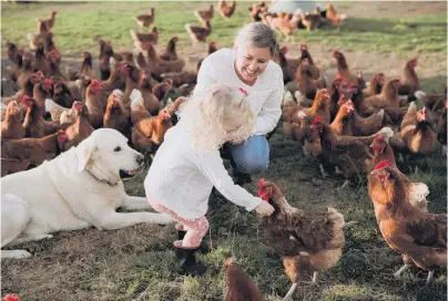  ?? PHOTO: SAM CARTER/MOMENT MAKER PHOTOGRAPH­Y ?? Country kid . . . Sage Campbell, pictured with mother Morgan and dog Buddy, is enjoying a rural upbringing in South Canterbury.